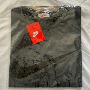 Gray and black Nike Athlete t shirt.